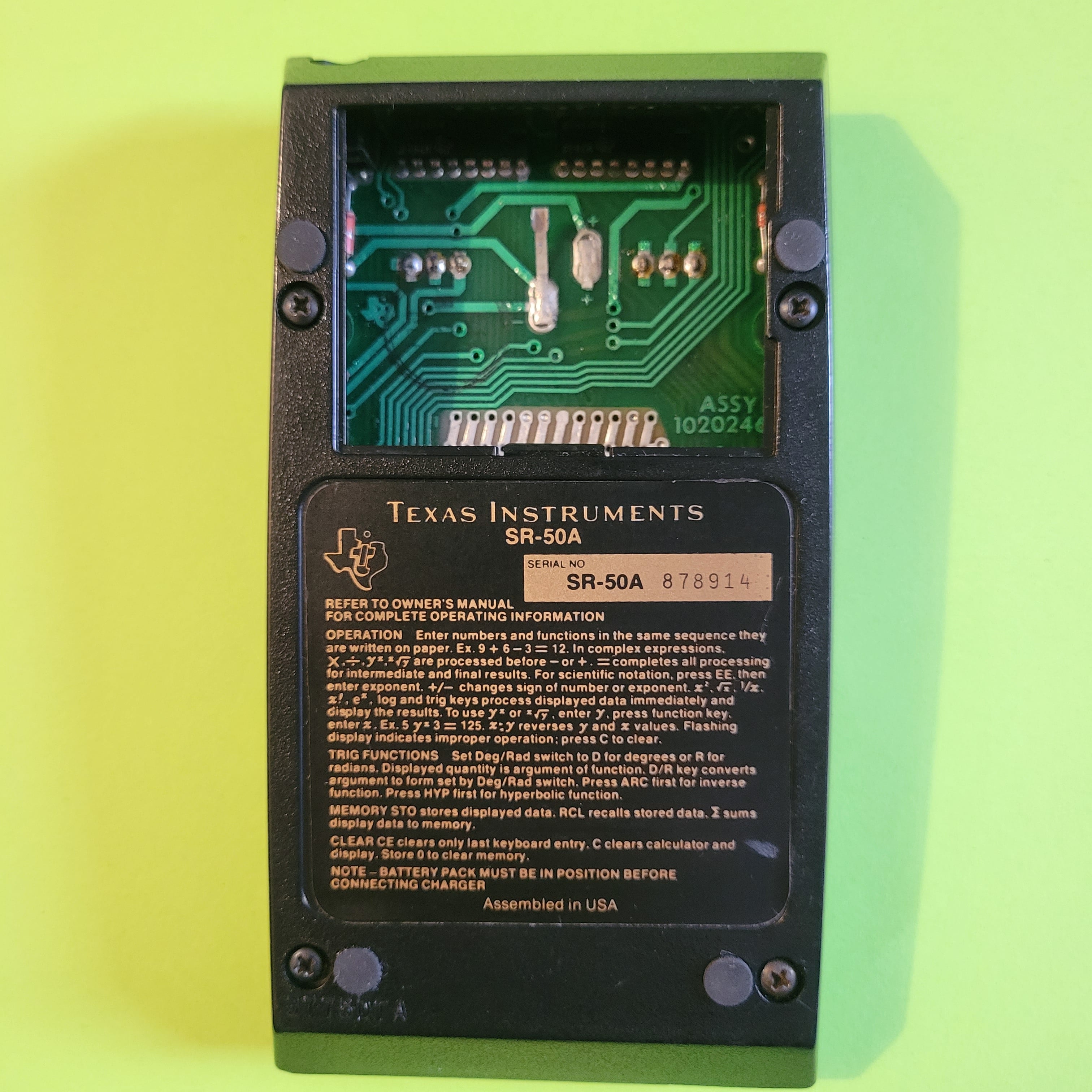 An image of the back of a Texas Instruments SR-50A scientific/engineering calculator